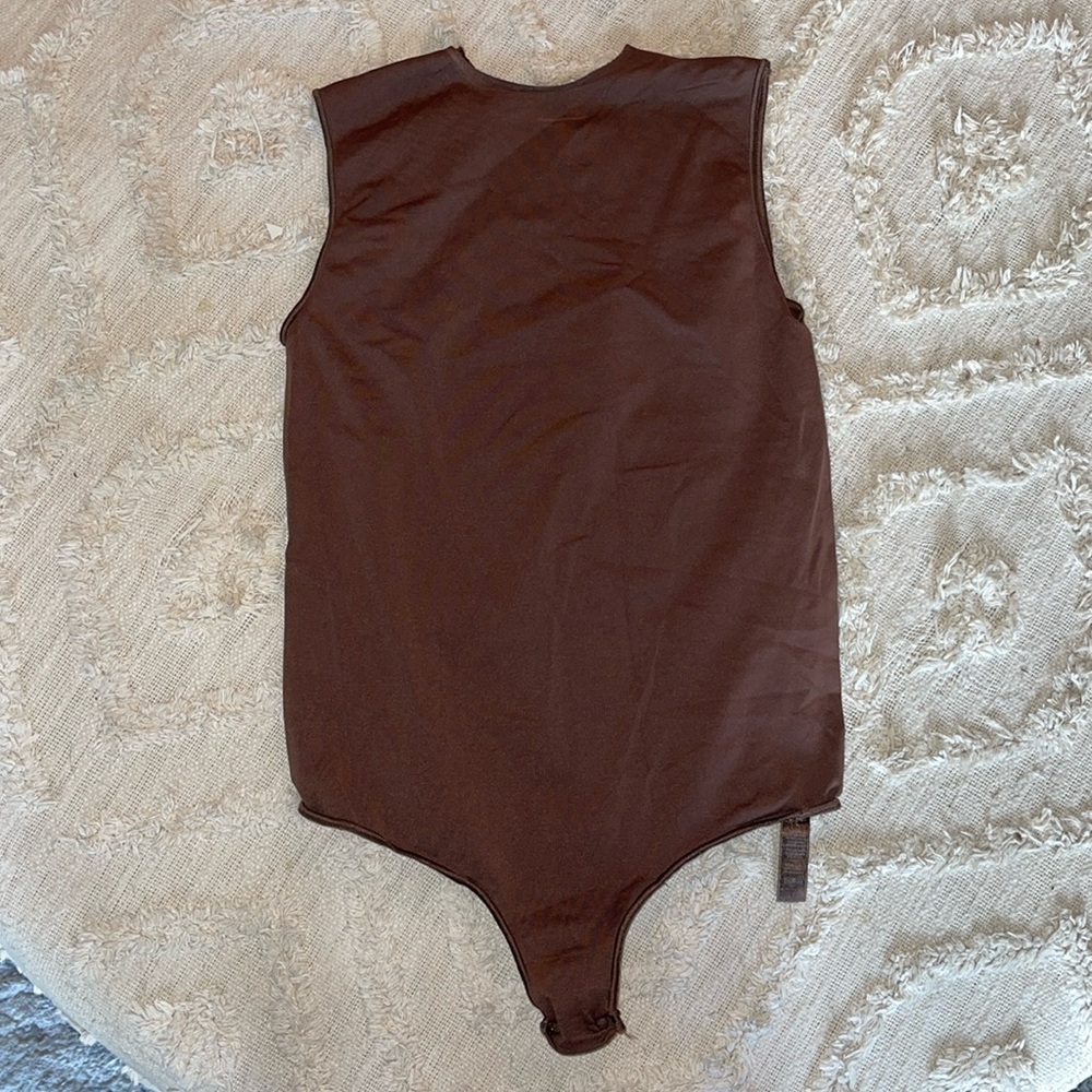 Brown skims essential bodysuit